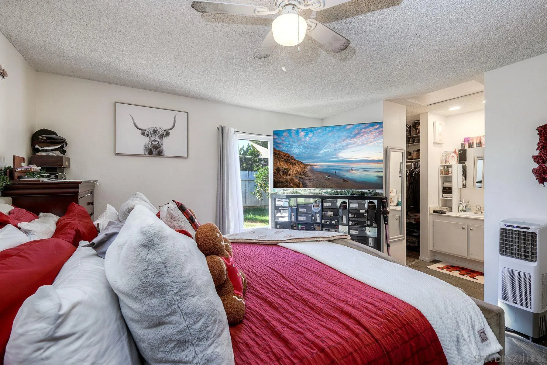 1302 Valencia Loop Chula Vista, CA 91910 - Photo 16 of 30 a bed room with a bed and a flat tv screen