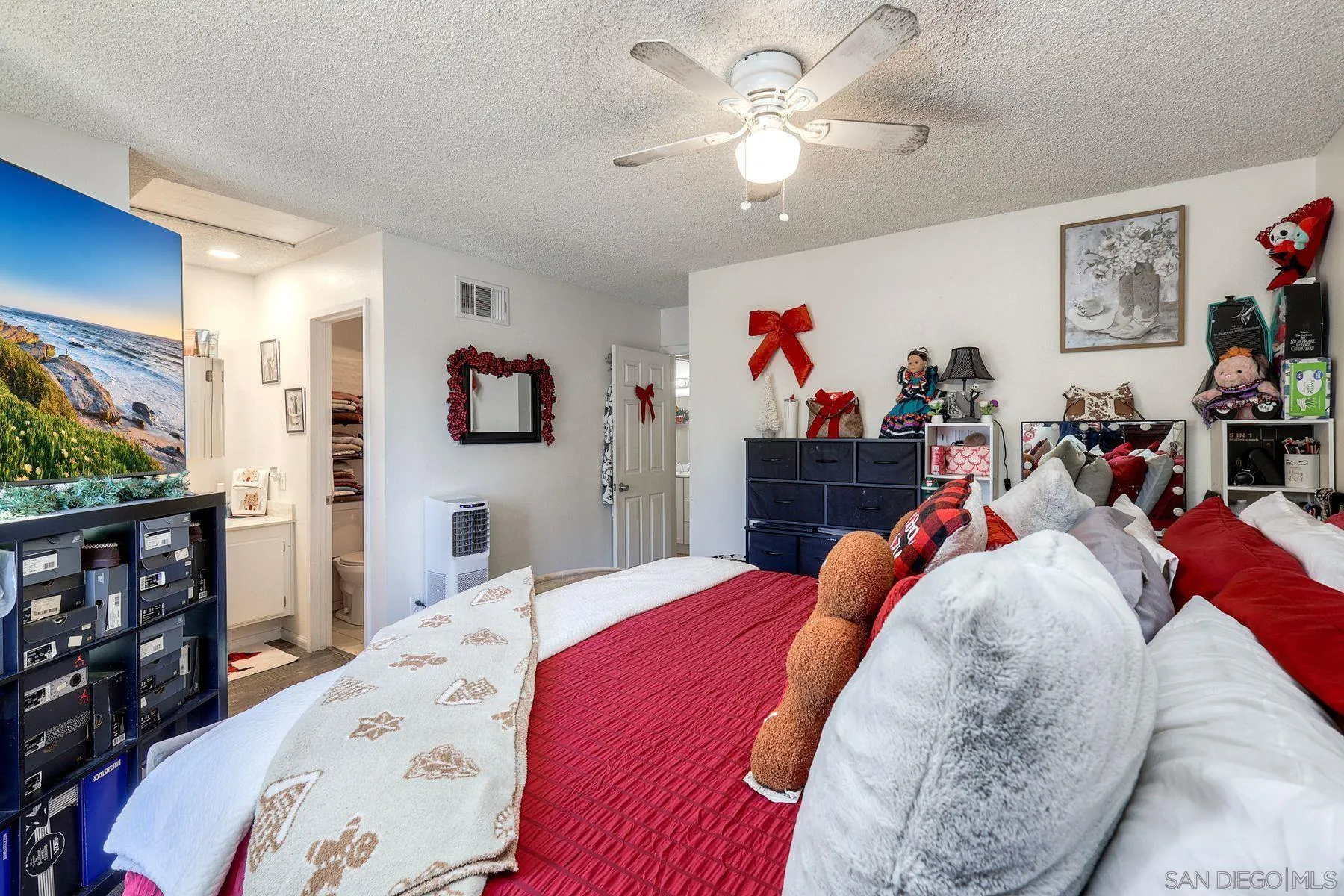 1302 Valencia Loop Chula Vista, CA 91910 - Photo 17 of 30 a bed room with a bed a couch and dresser