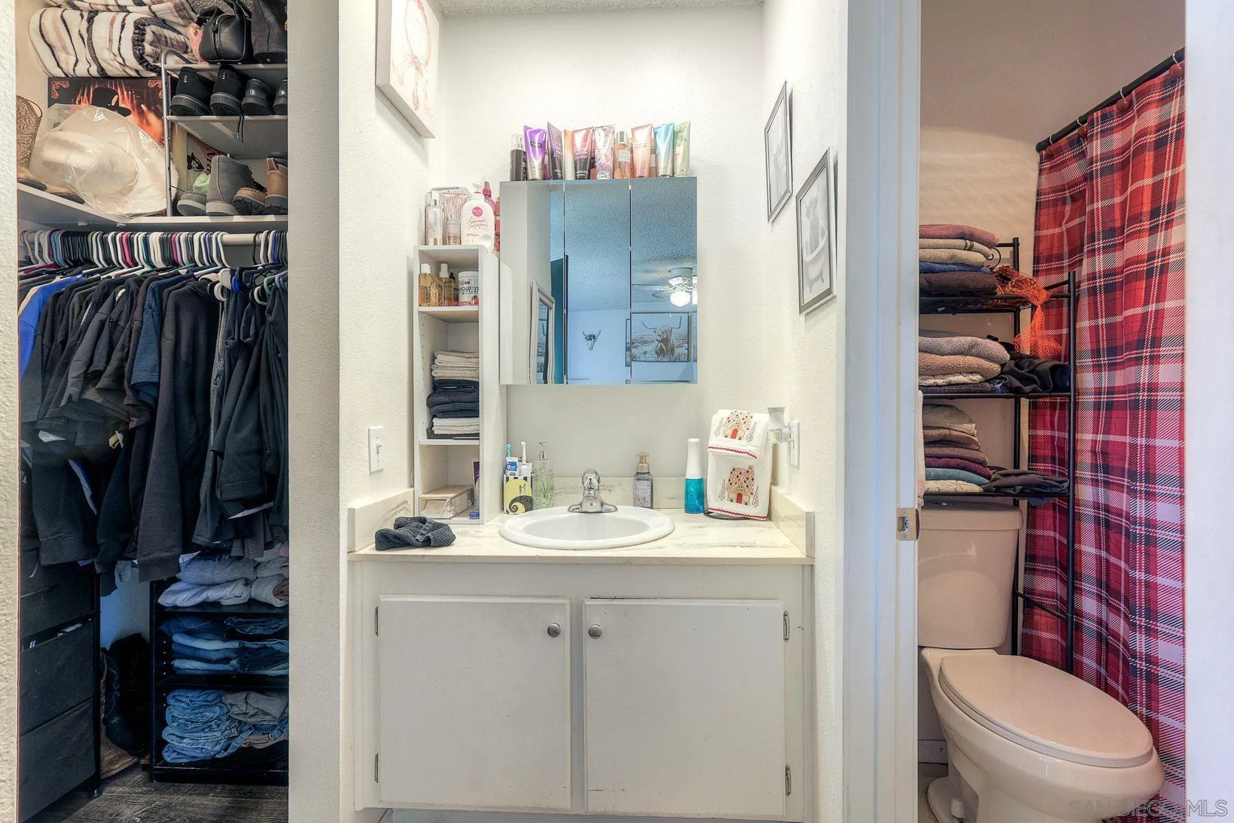 1302 Valencia Loop Chula Vista, CA 91910 - Photo 19 of 30 a bathroom with a sink a toilet and shower