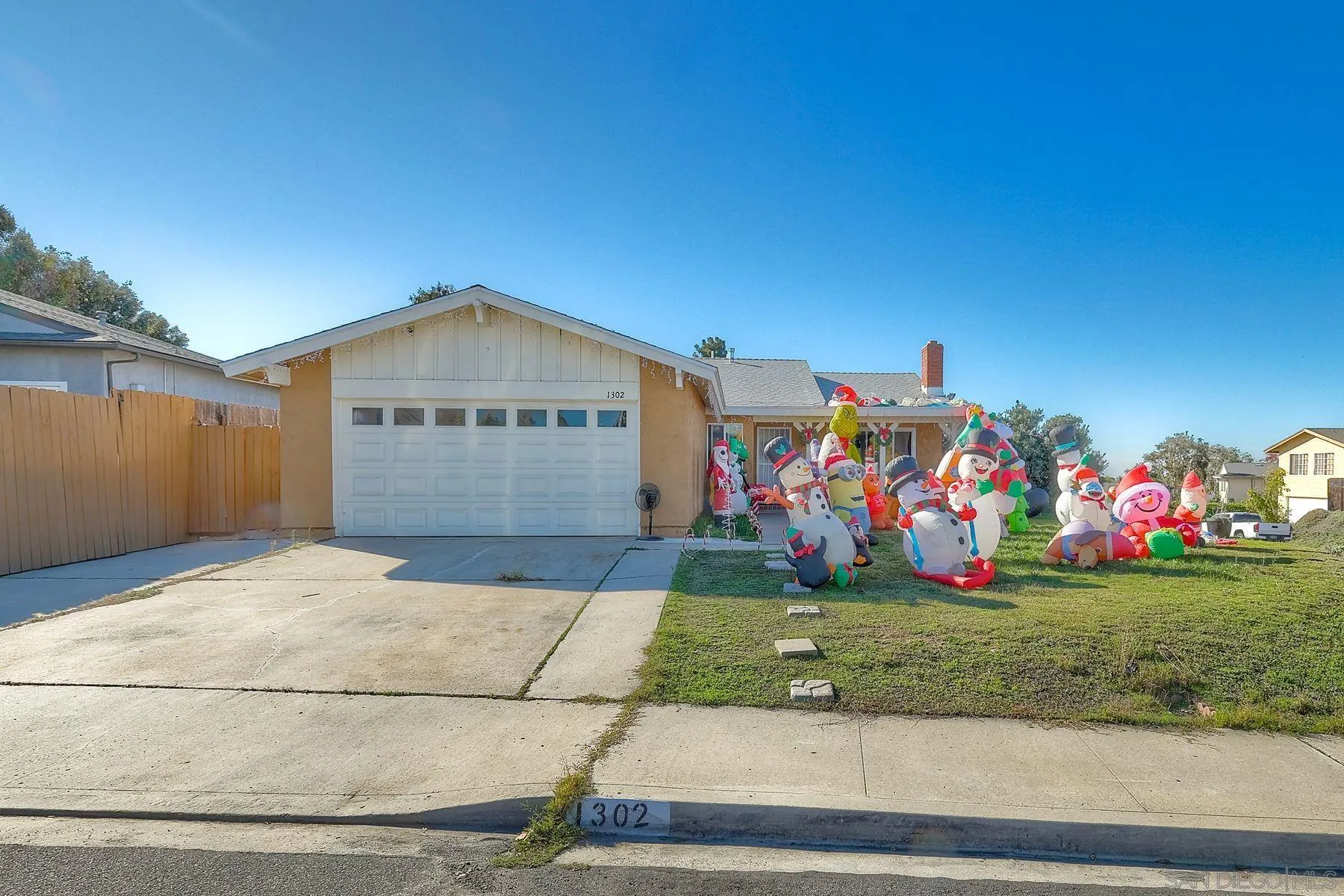 1302 Valencia Loop Chula Vista, CA 91910 - Photo 2 of 30 a front view of a house with a yard