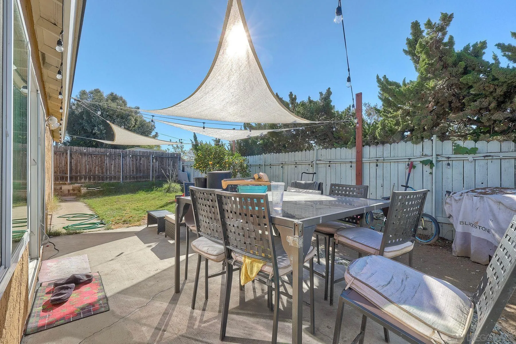1302 Valencia Loop Chula Vista, CA 91910 - Photo 28 of 30 a view of a patio with a table chairs and a table
