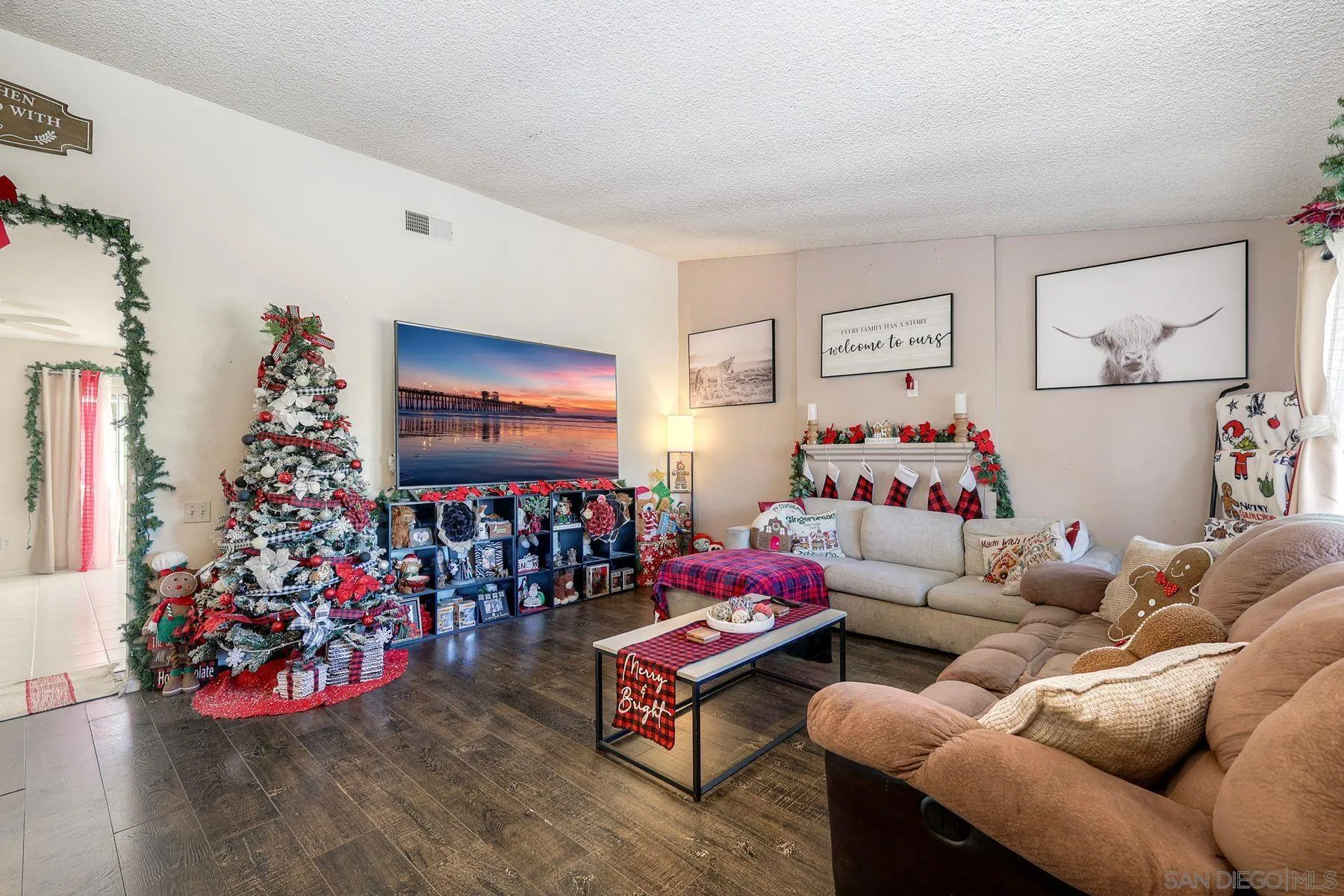 1302 Valencia Loop Chula Vista, CA 91910 - Photo 4 of 30 a living room with furniture and a flat screen tv