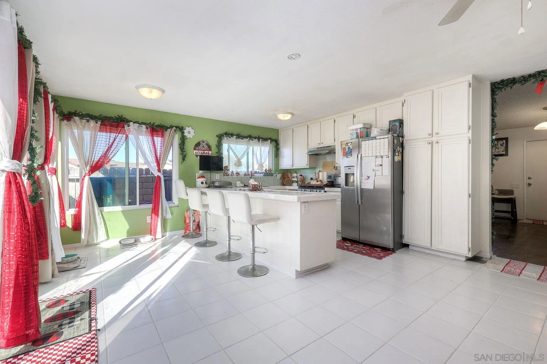 1302 Valencia Loop Chula Vista, CA 91910 - Photo 8 of 30 a view of a kitchen with refrigerator and a sink