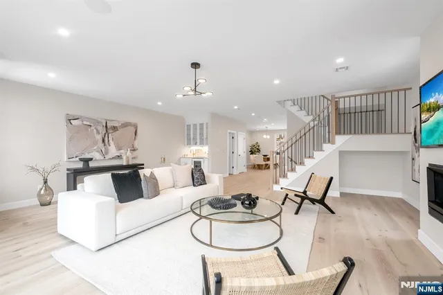 a living room with furniture and white walls