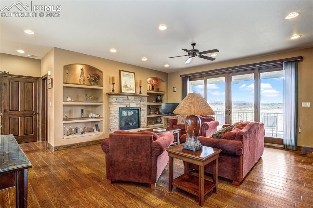 6453 Reno Road Pueblo, CO 81004 - Photo 11 of 36 a living room with furniture a window and a flat screen tv