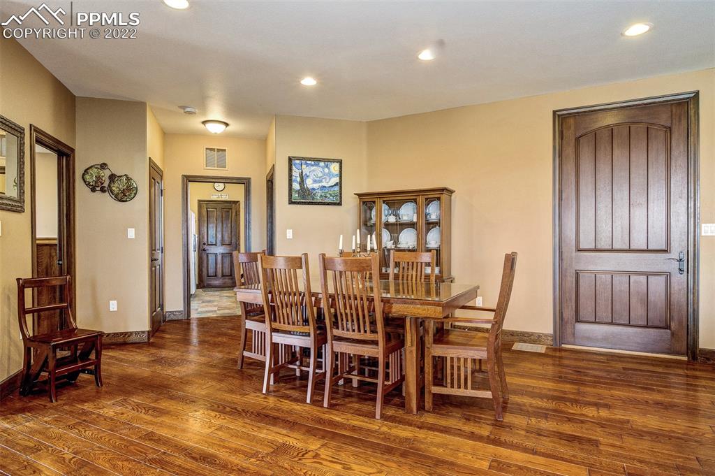 6453 Reno Road Pueblo, CO 81004 - Photo 14 of 36 a view of a a dining room with furniture window and wooden floor