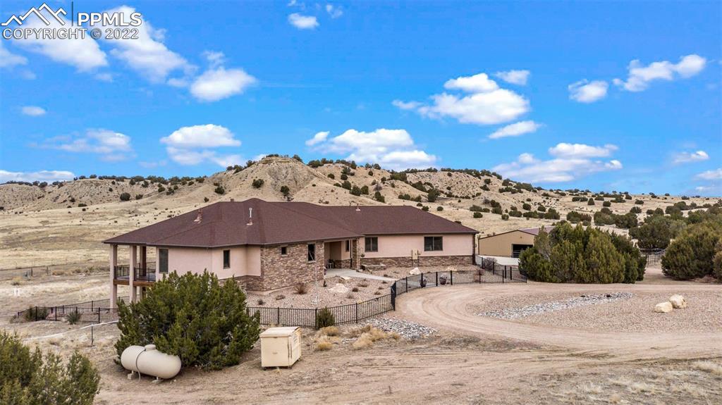 6453 Reno Road Pueblo, CO 81004 - Photo 4 of 36 a view of a house with backyard and sitting area
