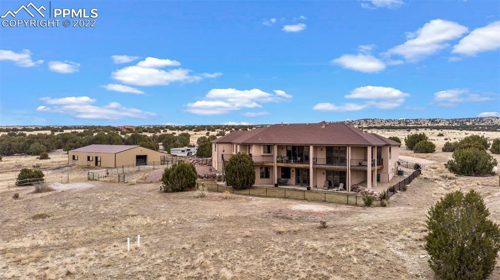 6453 Reno Road Pueblo, CO 81004 - Photo 7 of 36 a view of a house with a backyard