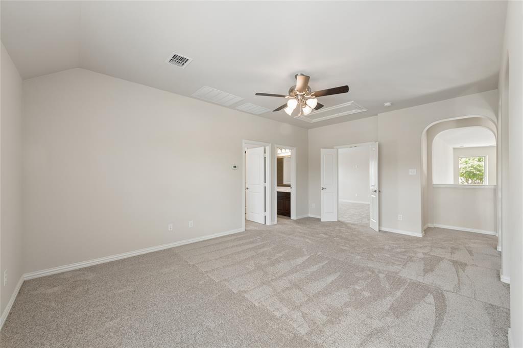 12571 Valley Spring Drive Frisco, TX 75035 - Photo 27 of 39 an empty room with windows and ceiling fan