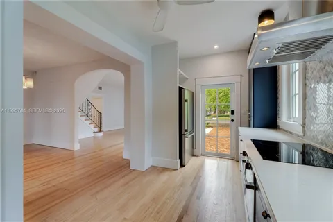 a view of kitchen with furniture and wooden floor