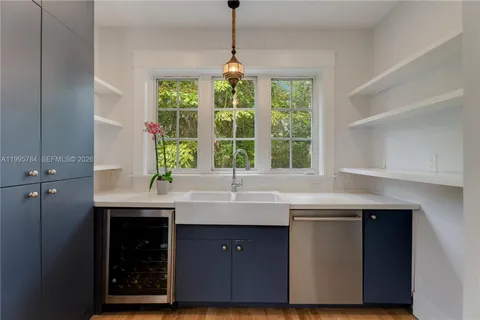 a kitchen with a sink and window