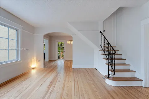 a view of entryway with wooden floor