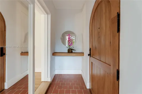 a view of a hallway view with wooden floor and staircase