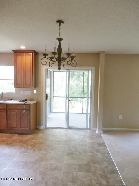 801 Crystal Spring Way St. Augustine, FL 32092 - Photo 11 of 15 a view of a kitchen with a sink cabinets and a window