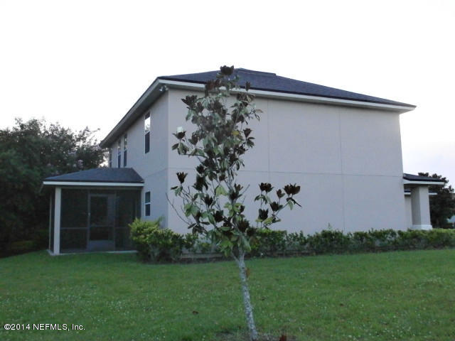 801 Crystal Spring Way St. Augustine, FL 32092 - Photo 15 of 15 a front view of a house with garden