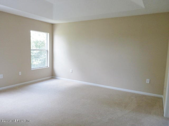 801 Crystal Spring Way St. Augustine, FL 32092 - Photo 5 of 15 an empty room with windows