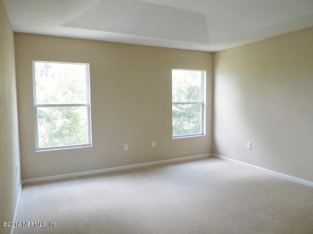 801 Crystal Spring Way St. Augustine, FL 32092 - Photo 6 of 15 an empty room with a window
