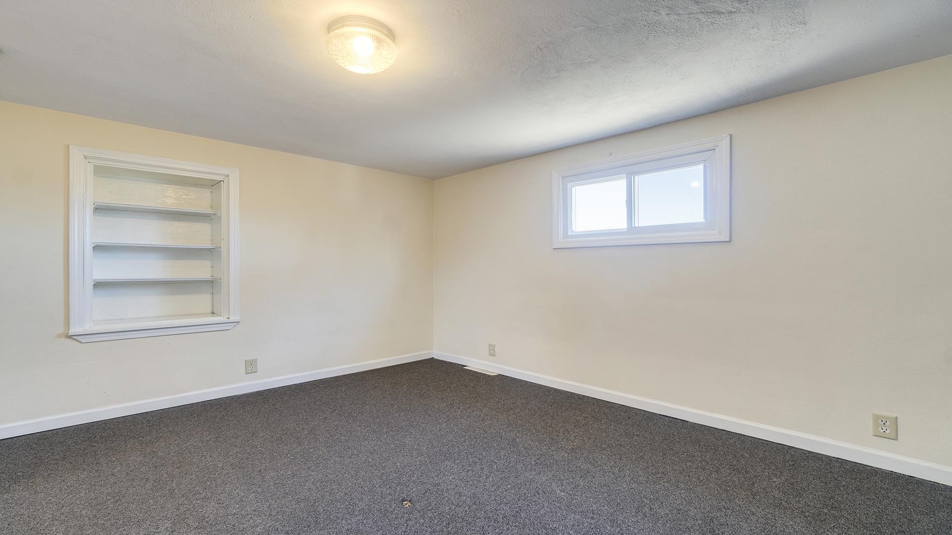 3702 Genoa Road Cherry Valley, IL 61016 - Photo 13 of 17 an empty room with a window
