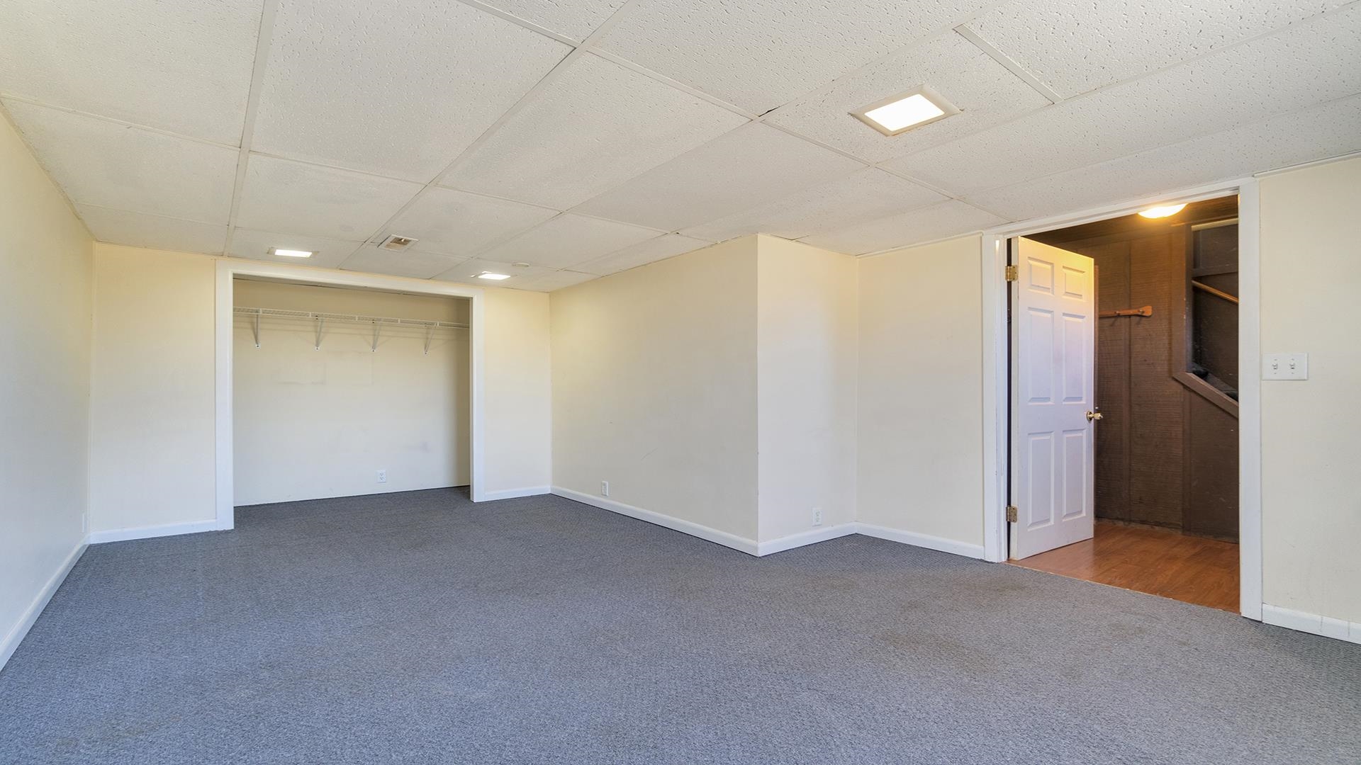 3702 Genoa Road Cherry Valley, IL 61016 - Photo 14 of 17 an empty room with closet and wooden floor