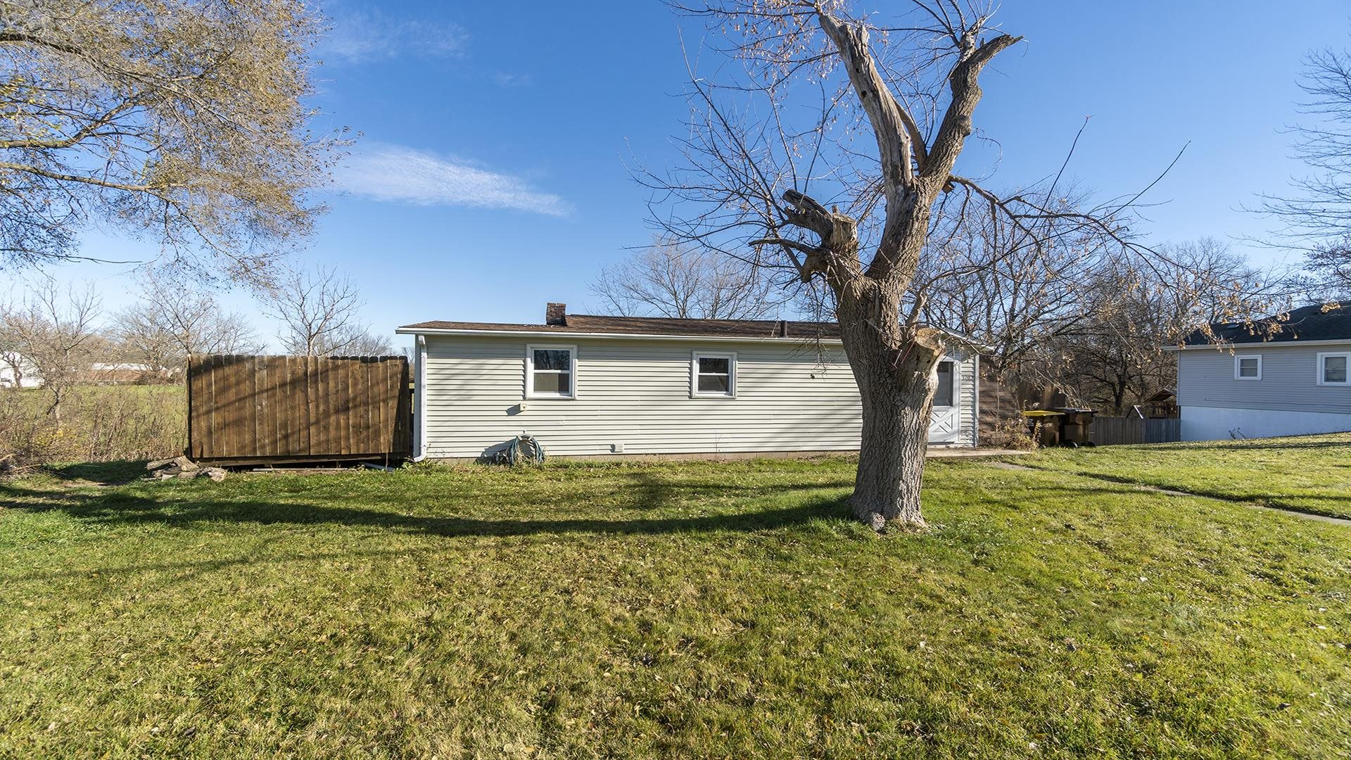 3702 Genoa Road Cherry Valley, IL 61016 - Photo 2 of 17 a view of a house with a yard