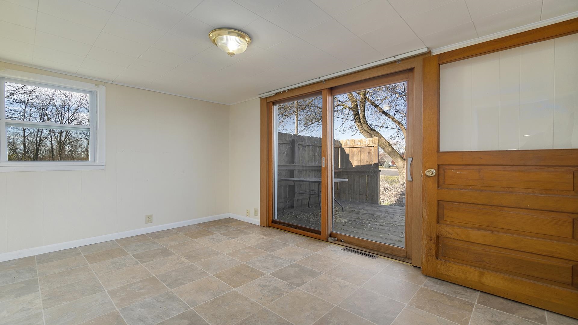 3702 Genoa Road Cherry Valley, IL 61016 - Photo 10 of 17 a view of an empty room and window