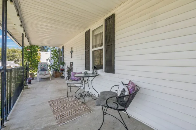 a view of two chairs in the balcony