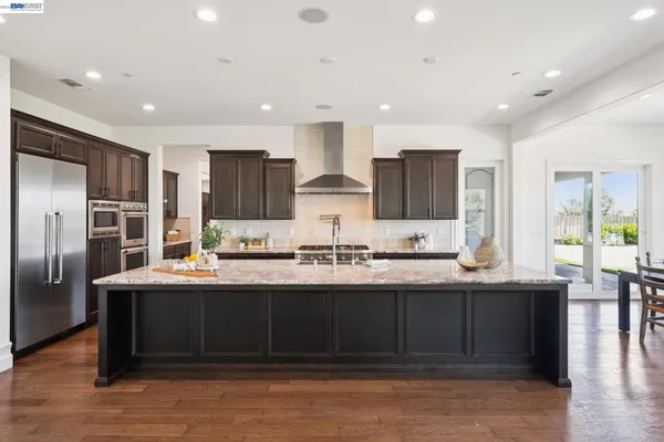 a kitchen with lots of counter top space sink and appliances