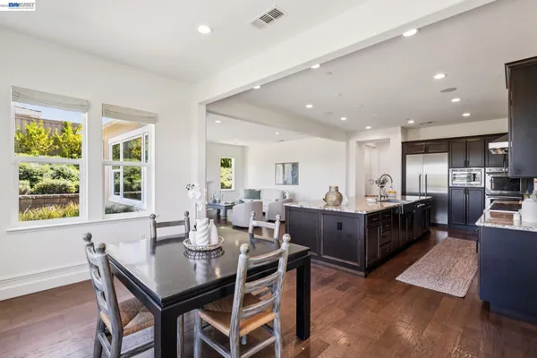 a dining room with furniture and window