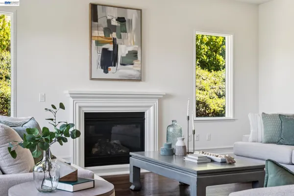 a spacious bedroom with a bed and a fireplace