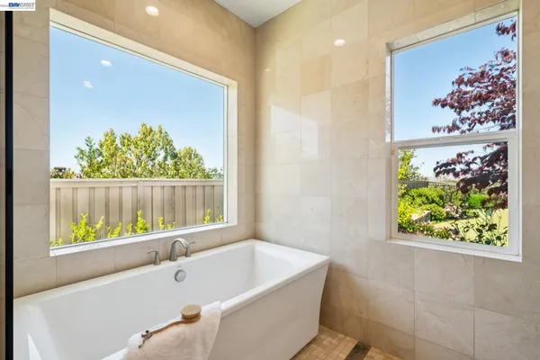 a bathroom with a sink double vanity and a mirror