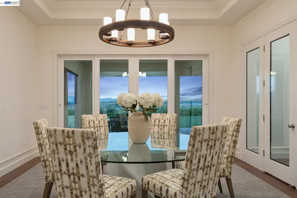a kitchen with stainless steel appliances granite countertop a sink a stove a refrigerator and a oven