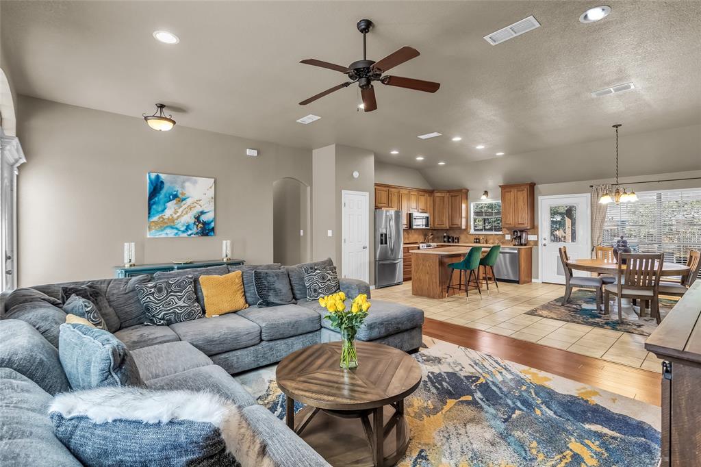226 King George Road Ponder, TX 76259 - Photo 15 of 39 Living area featuring recessed lighting, a ceiling fan, arched walkways, light wood-style flooring, and a chandelier