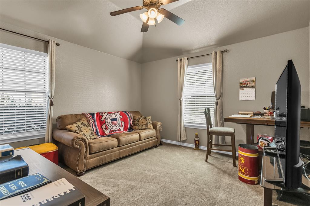 226 King George Road Ponder, TX 76259 - Photo 21 of 39 Living area featuring carpet, ceiling fan, and a desk
