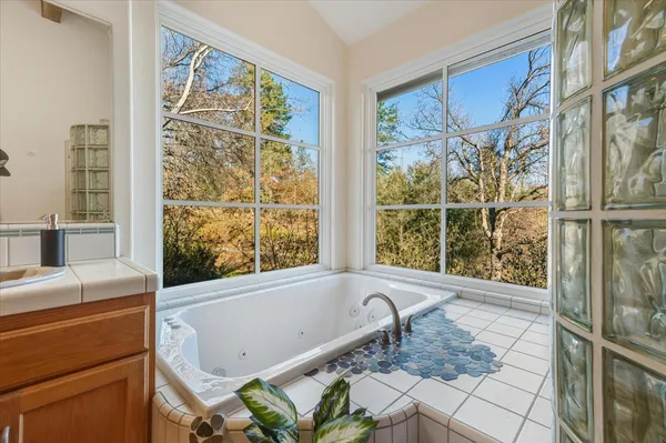 a kitchen with granite countertop lots of counter top space and stainless steel appliances