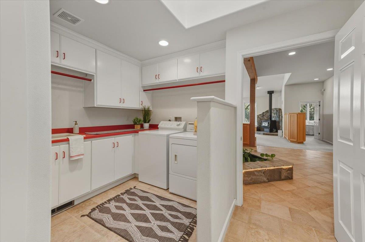 14771 Mt Olive Road Grass Valley, CA 95945 - Photo 41 of 96 Laundry room with wash sink and lots of storage.