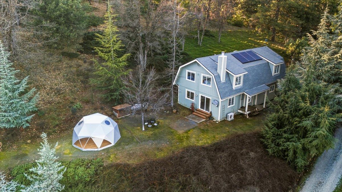 14771 Mt Olive Road Grass Valley, CA 95945 - Photo 7 of 96 Separate ADU with 2beds 1 full + 1/2 bath with attached 2 car garage with office & 1/2 bath, additional storage, geodome, views and overlooking pond. Owned solar and very private from main house.