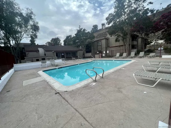 a view of a swimming pool with a patio