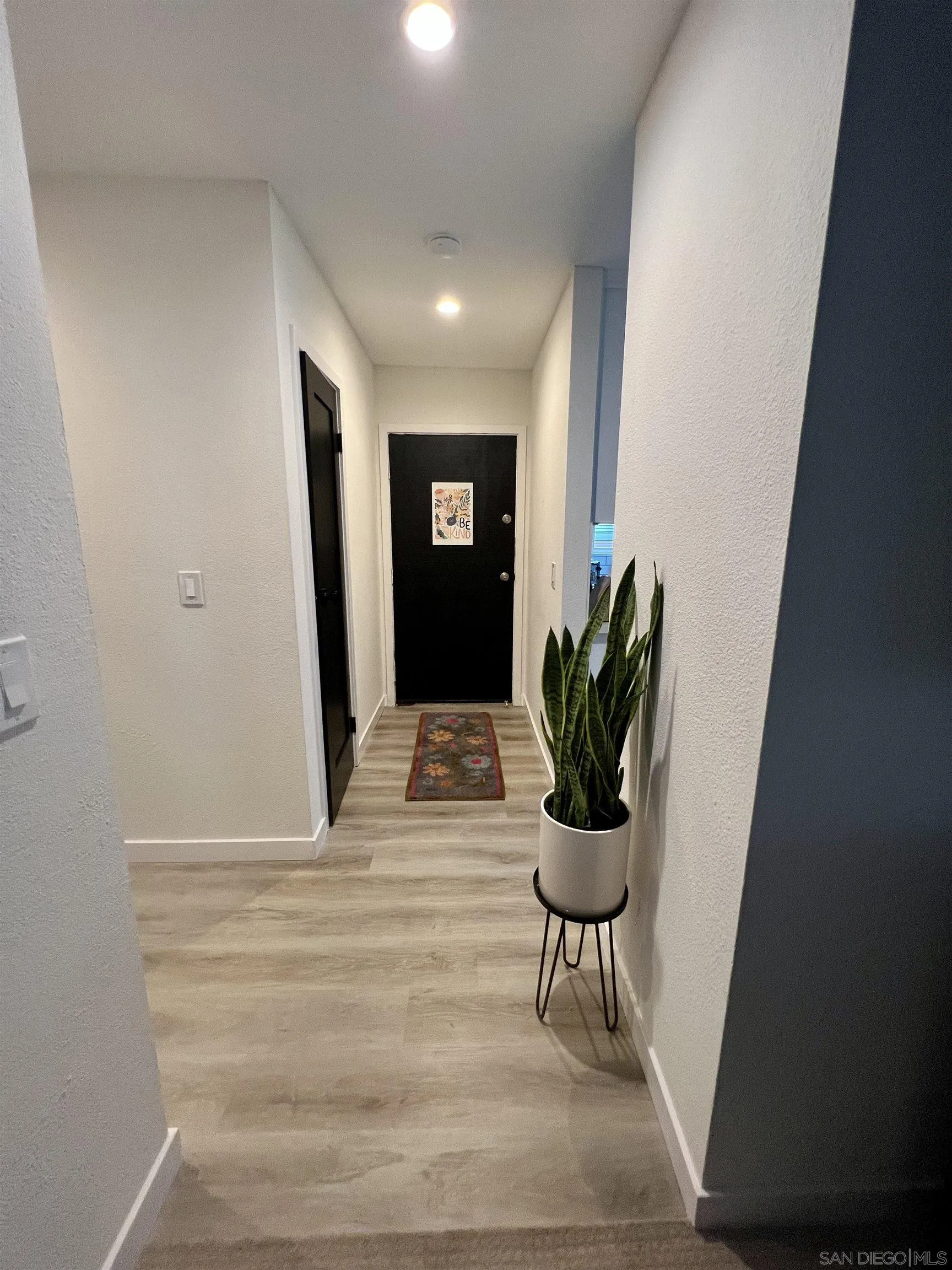 5462 Adobe Falls Road, Unit 11 San Diego, CA 92120 - Photo 2 of 19 a bathroom with a potted plant
