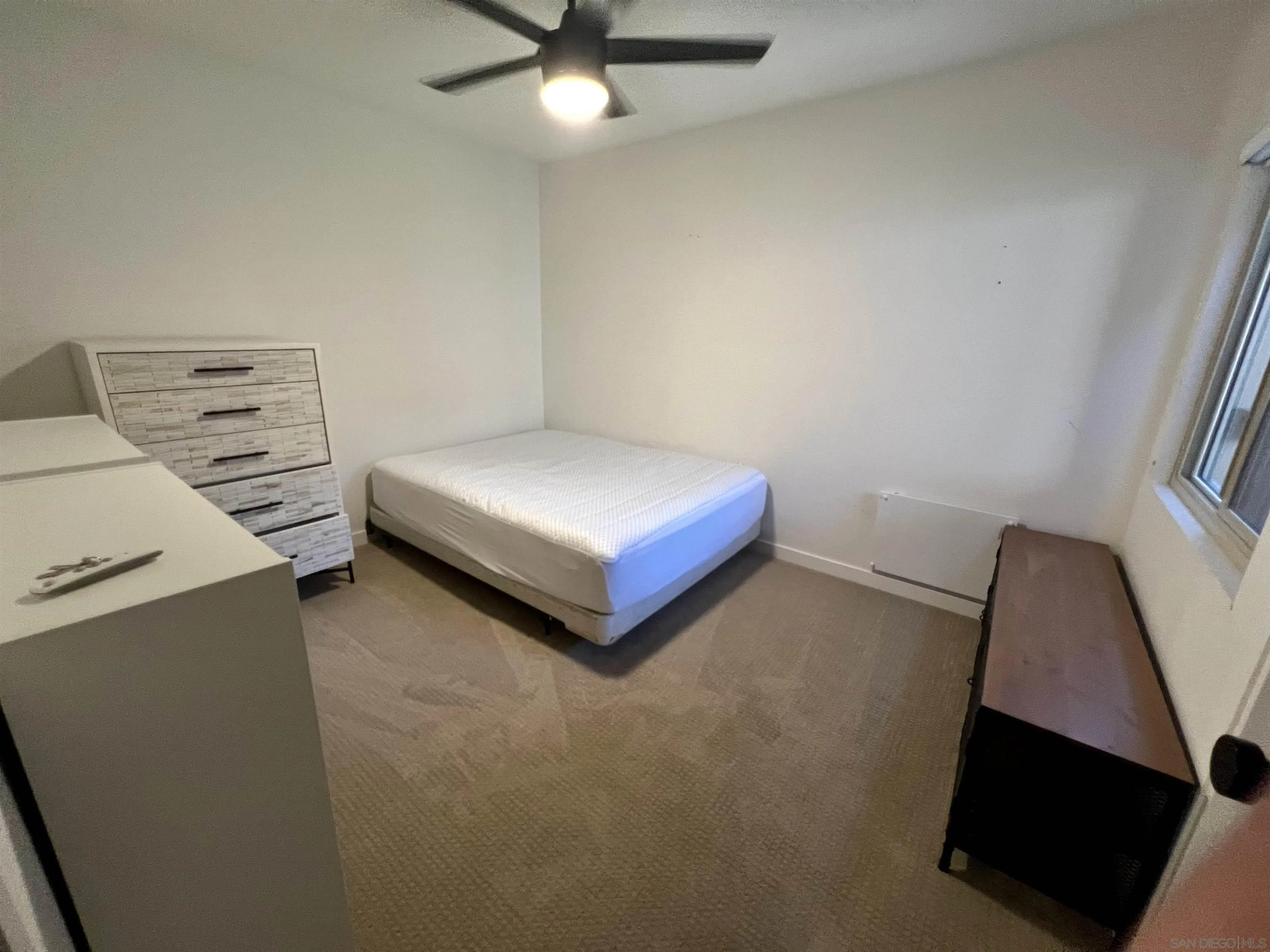 5462 Adobe Falls Road, Unit 11 San Diego, CA 92120 - Photo 7 of 19 a room with furniture and a chandelier
