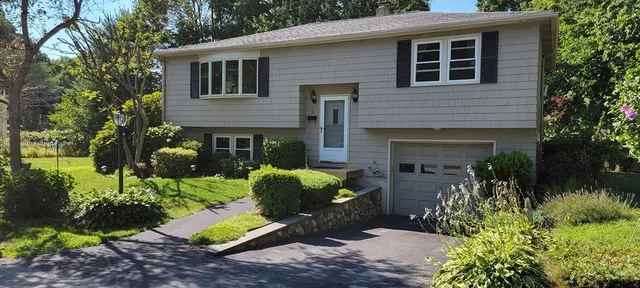 a view of house with outdoor space and seating area
