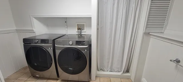 a utility room with dryer and washer