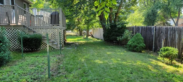 a backyard of a house with lots of green space
