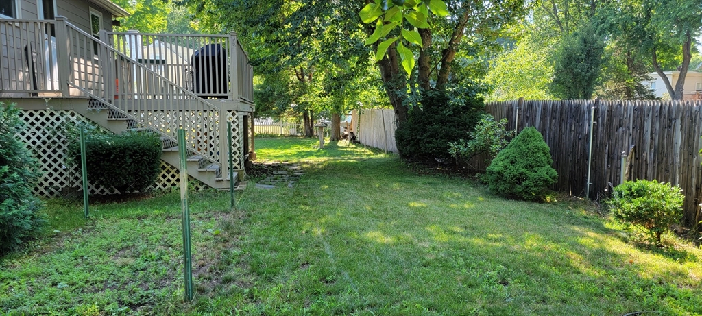 35 Park Avenue Reading, MA 01867 - Photo 15 of 15 a backyard of a house with lots of green space