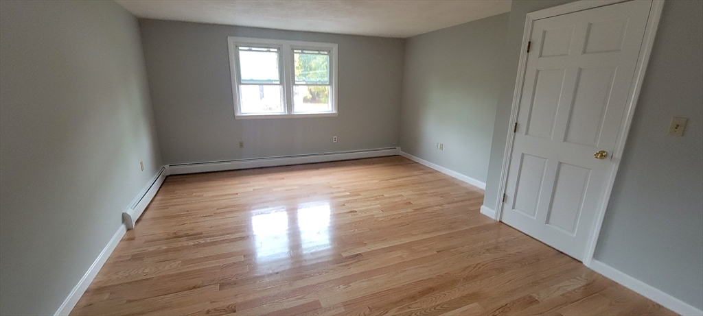 35 Park Avenue Reading, MA 01867 - Photo 7 of 15 a view of empty room with wooden floor and fan