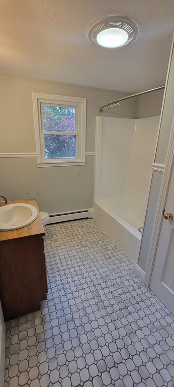 35 Park Avenue Reading, MA 01867 - Photo 10 of 15 a bathroom with a sink a toilet and a shower