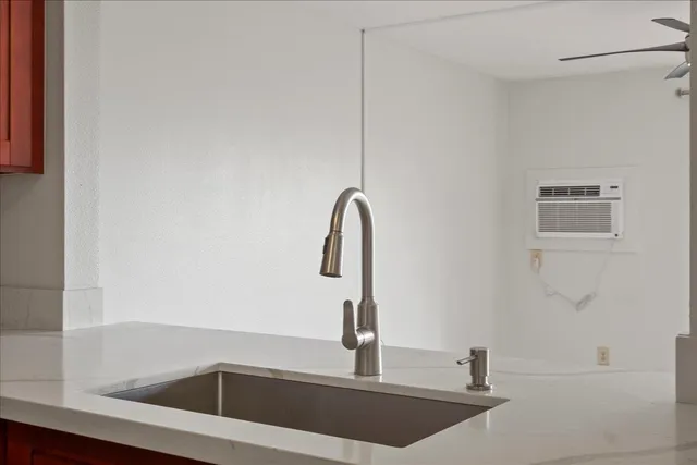 a bathroom with a sink and mirror