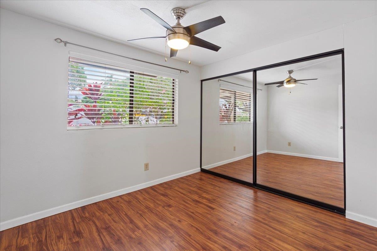 2747 South Kihei Road, Unit A107 Kihei, HI 96753 - Photo 23 of 46 a view of an empty room with a window and wooden floor
