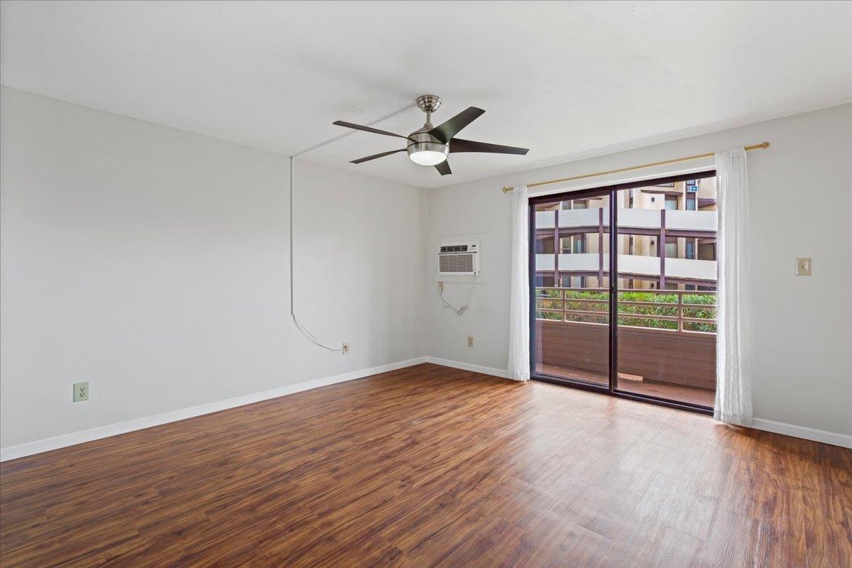 2747 South Kihei Road, Unit A107 Kihei, HI 96753 - Photo 33 of 46 wooden floor in an empty room with a window