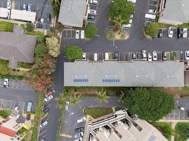an aerial view of a house with a swimming pool