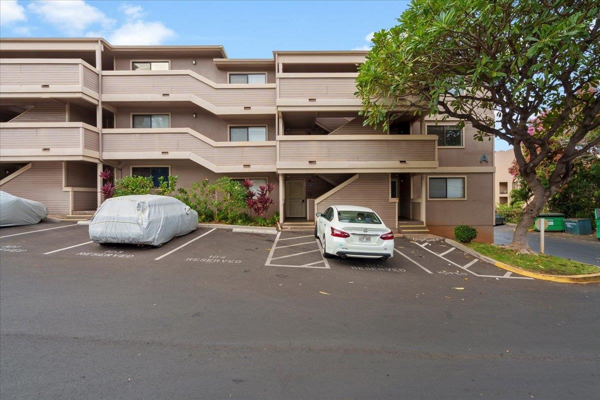 2747 South Kihei Road, Unit A107 Kihei, HI 96753 - Photo 45 of 46 a car parked in front of a white house